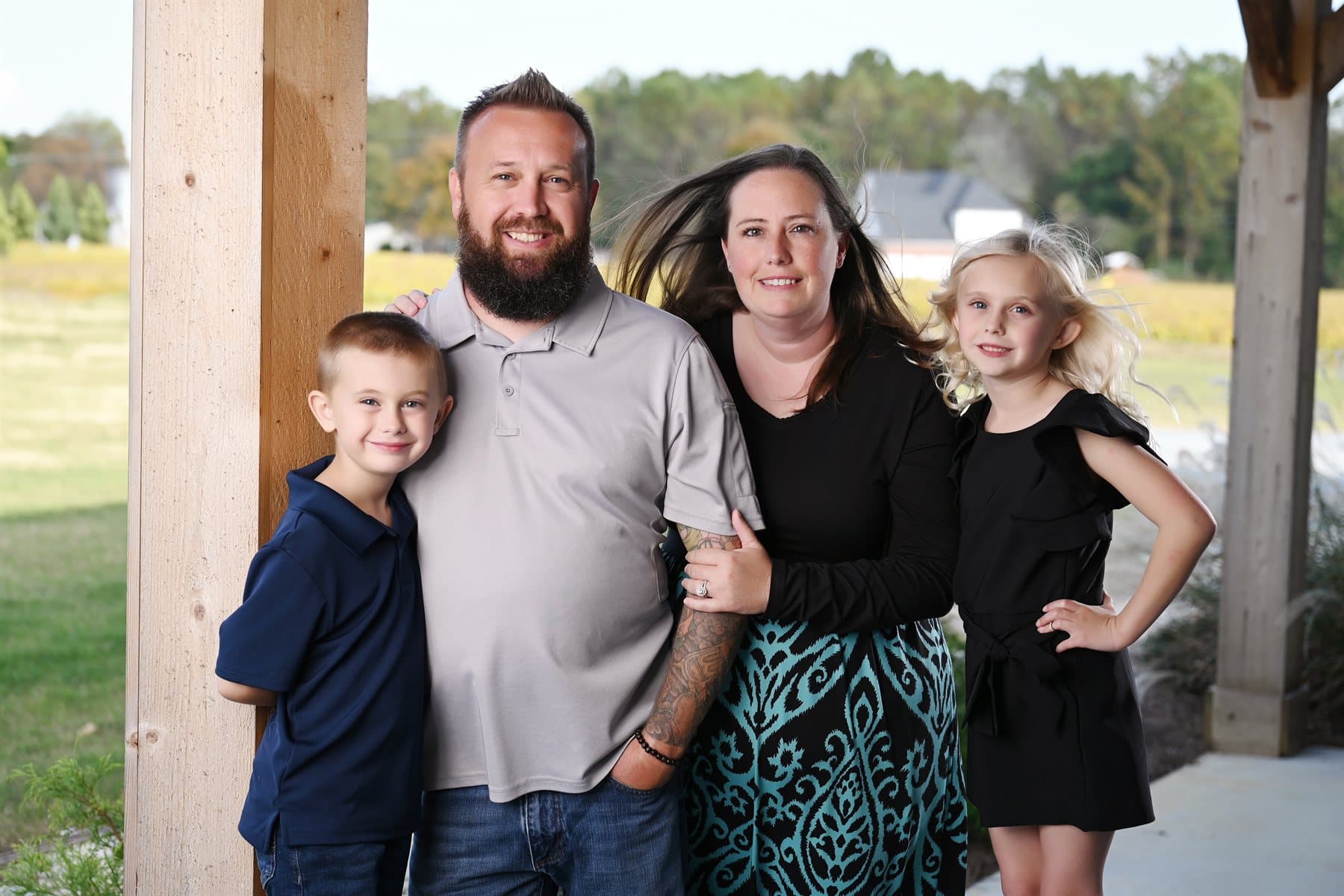 Lee and Julie Carter with their children on the porch